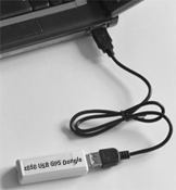 z050 USB GPS dongle connected to a laptop with USB extension cable